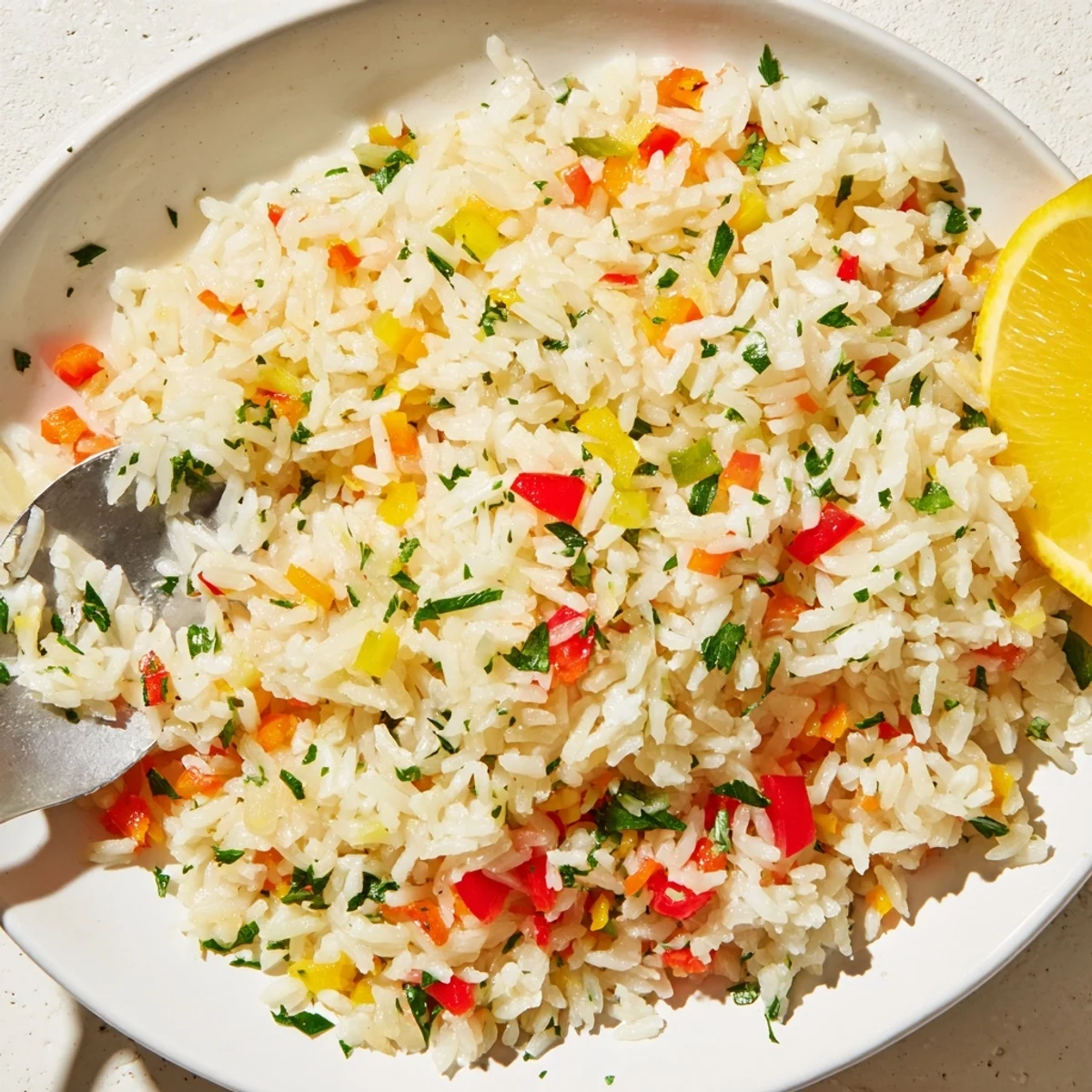 Fluffy Rice Pilaf with Peppers and Onions in a skillet, featuring vibrant red and green bell peppers and onions.