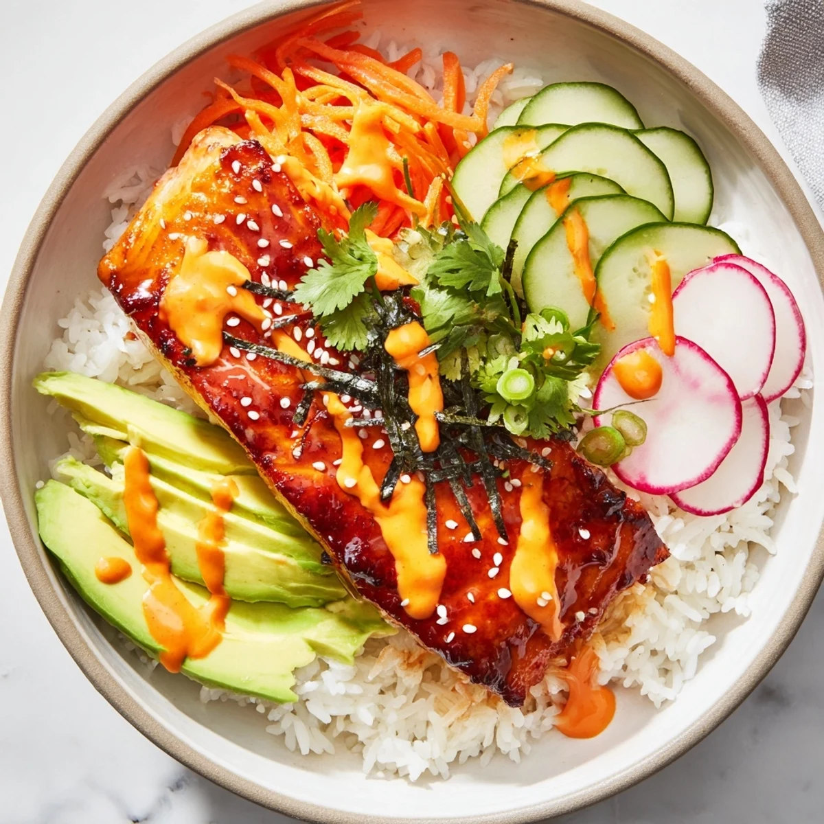 A vibrant bowl of Teriyaki Salmon Rice Taco Bowls with Pickled Veggies garnished with avocado and sesame seeds.