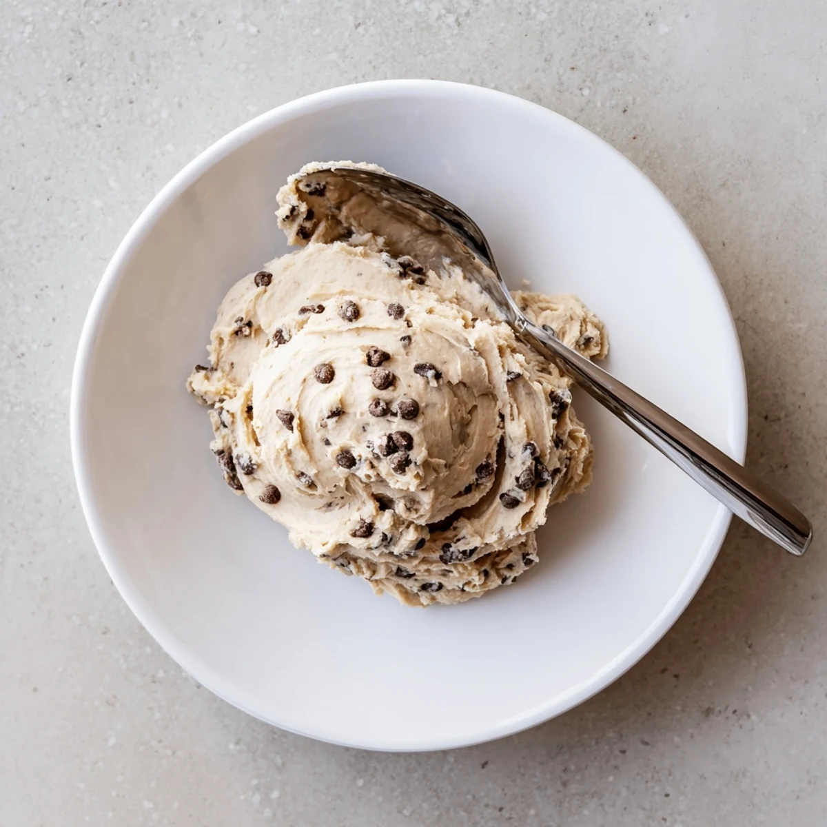 Creamy, edible cookie dough frosting swirled with mini chocolate chips for cupcakes.