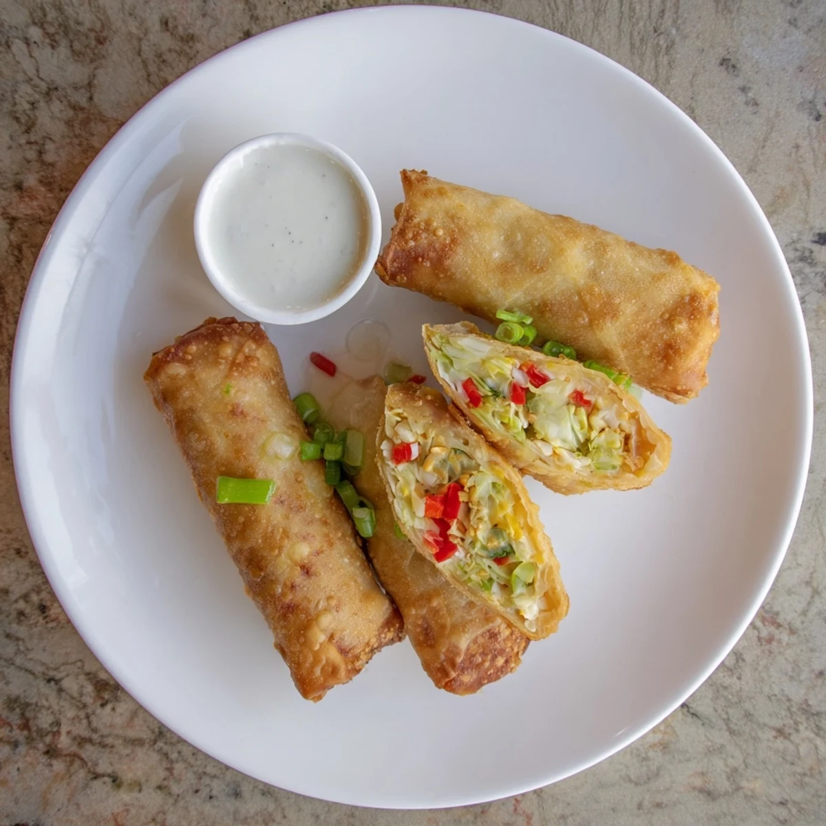 Crispy fried Voodoo Egg rolls showcasing seasoned chicken and cabbage filling ready for party snacking