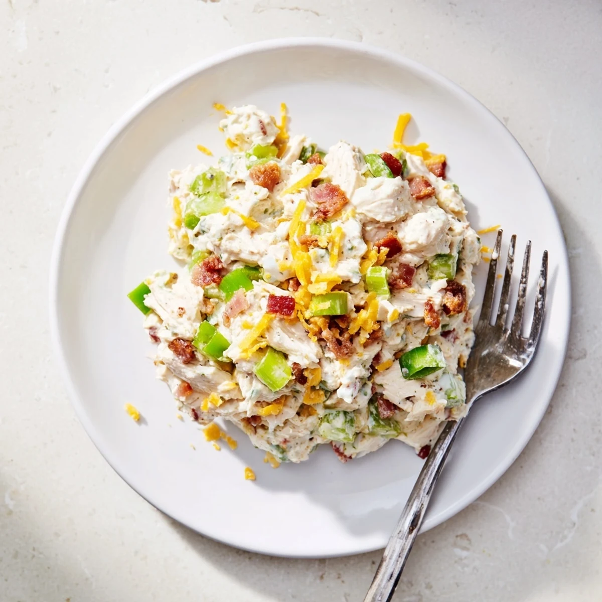 Golden shredded chicken mixed with cream cheese cheddar and jalapenos in this keto-friendly salad