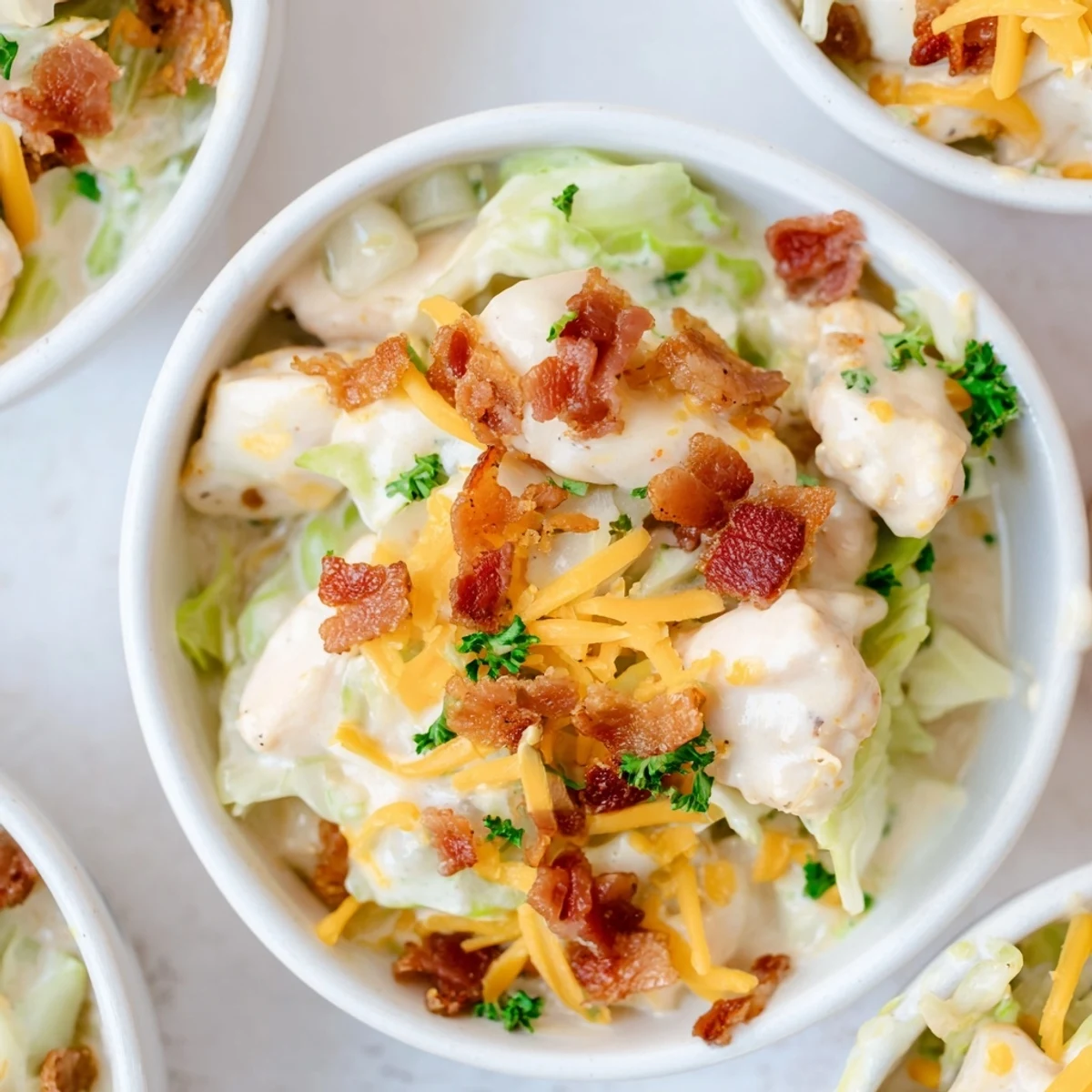 Tender chicken and crispy bacon tossed with cabbage in creamy chicken bacon ranch cabbage bowls sauce