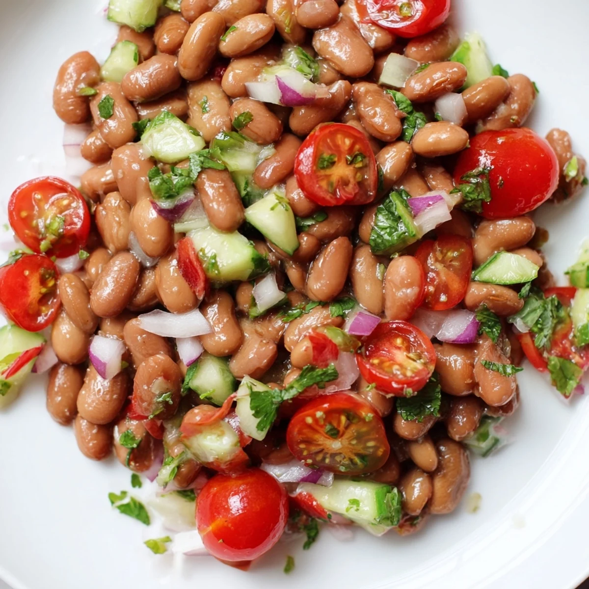 Colorful pinto bean salad tossed with crisp veggies and bright lime dressing