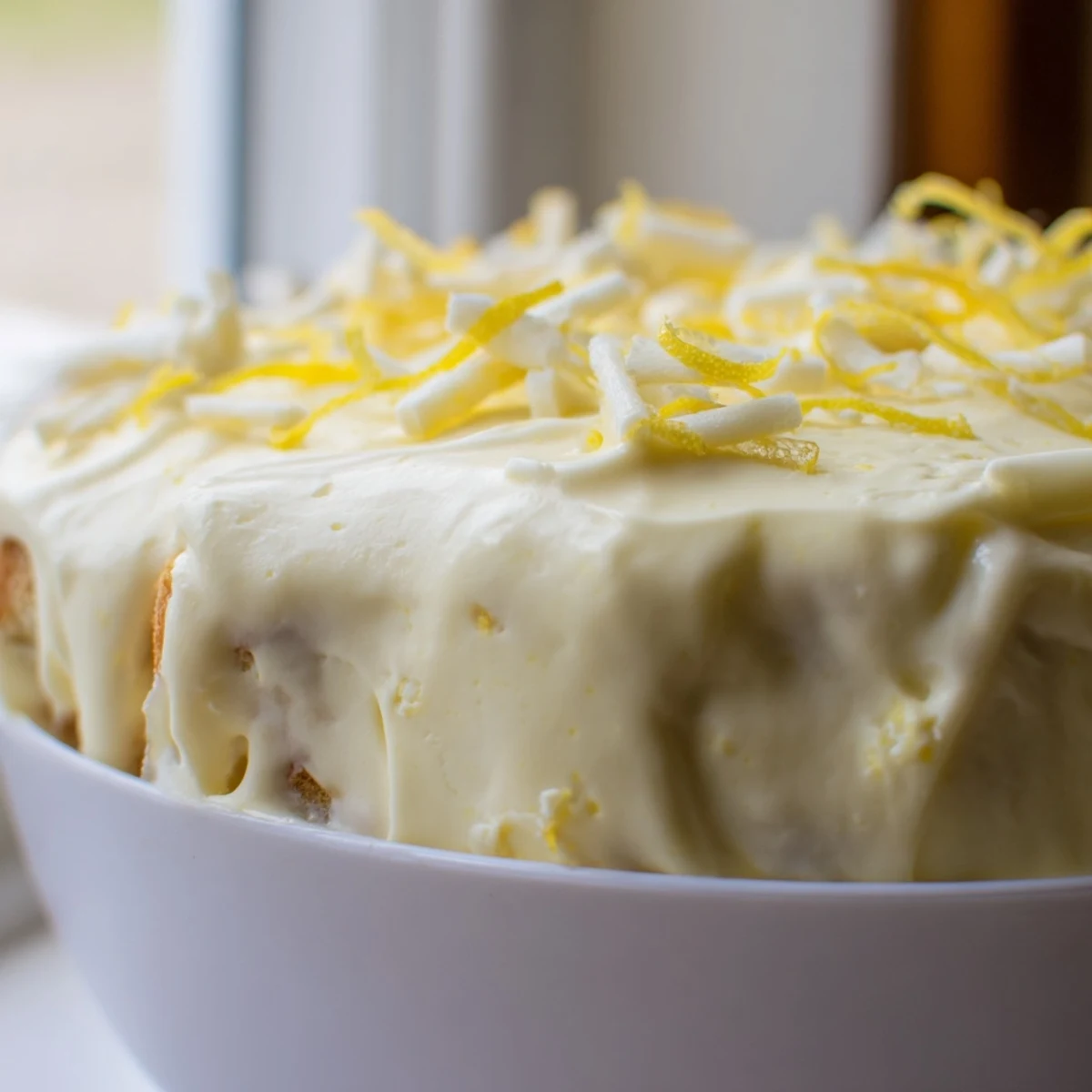 No-bake lemon tiramisu slices revealing soaked ladyfingers and smooth mascarpone cream