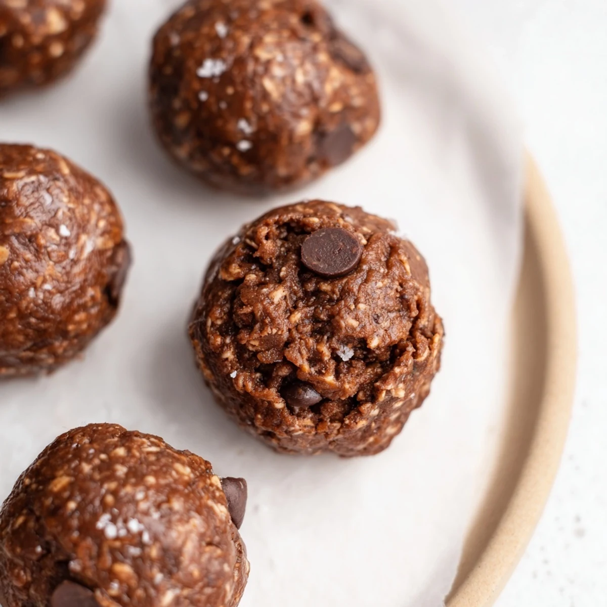 Homemade Brownie Protein Bites rolled into even balls, studded with chips  