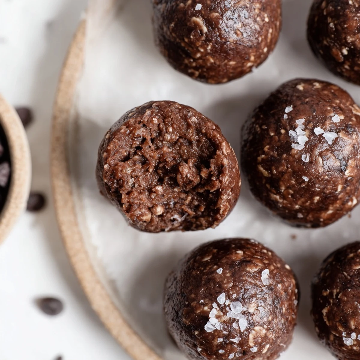Brownie Protein Bites served with coffee, glossy chocolate centers and peanut aroma