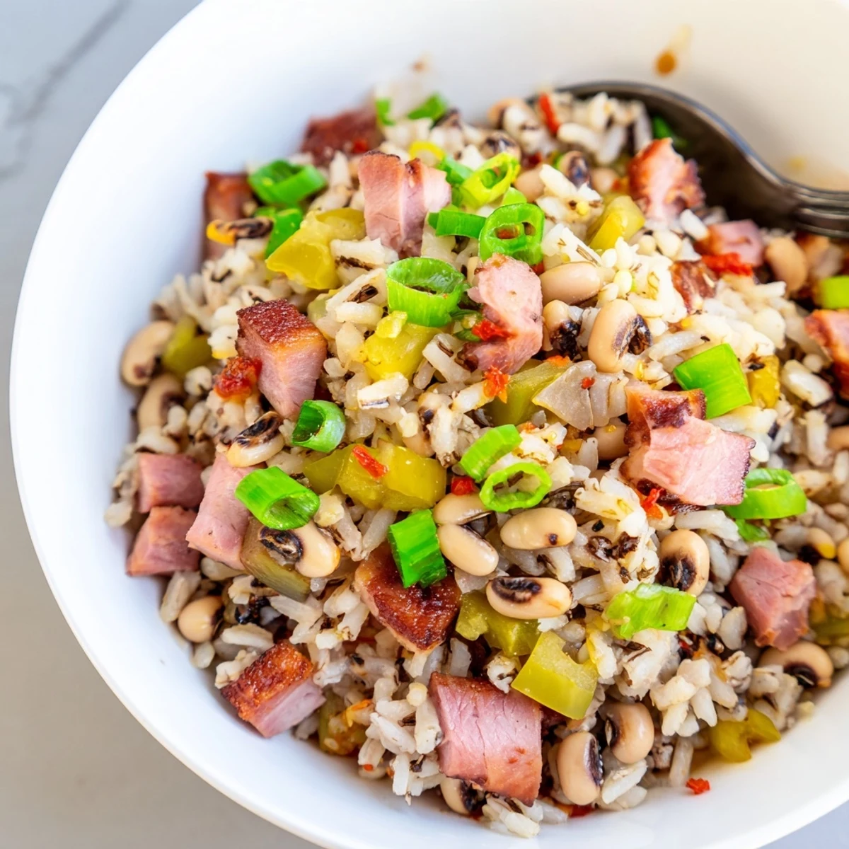 Hearty Smoky Southern Hoppin John steaming in bowl, tender peas and fluffy rice