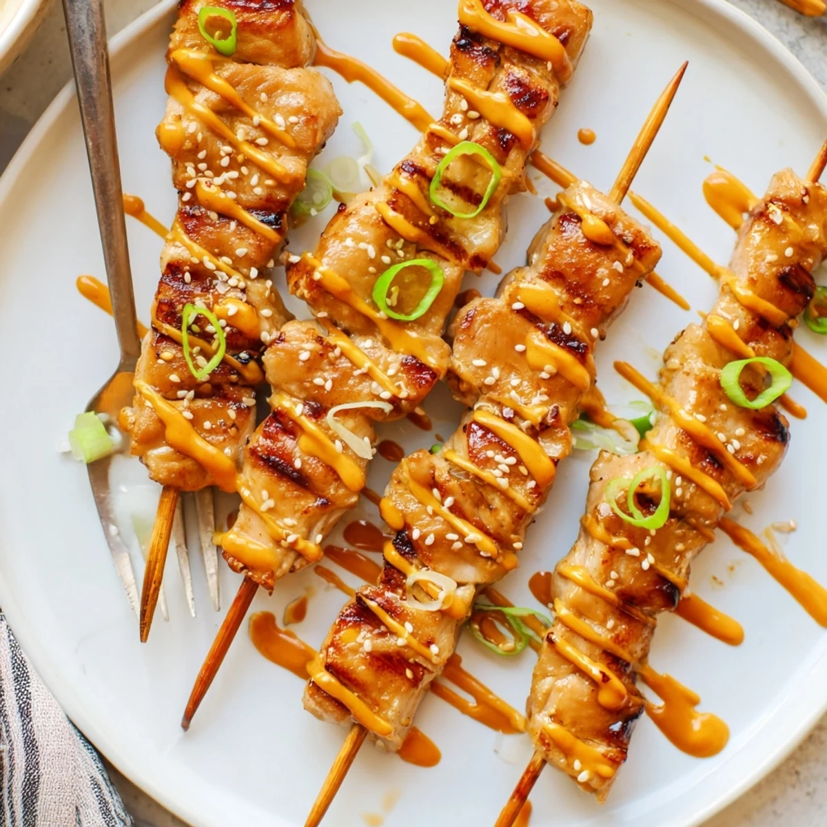 Weeknight-ready Bang Bang Chicken Skewers smoky, tender bites paired with extra sauce